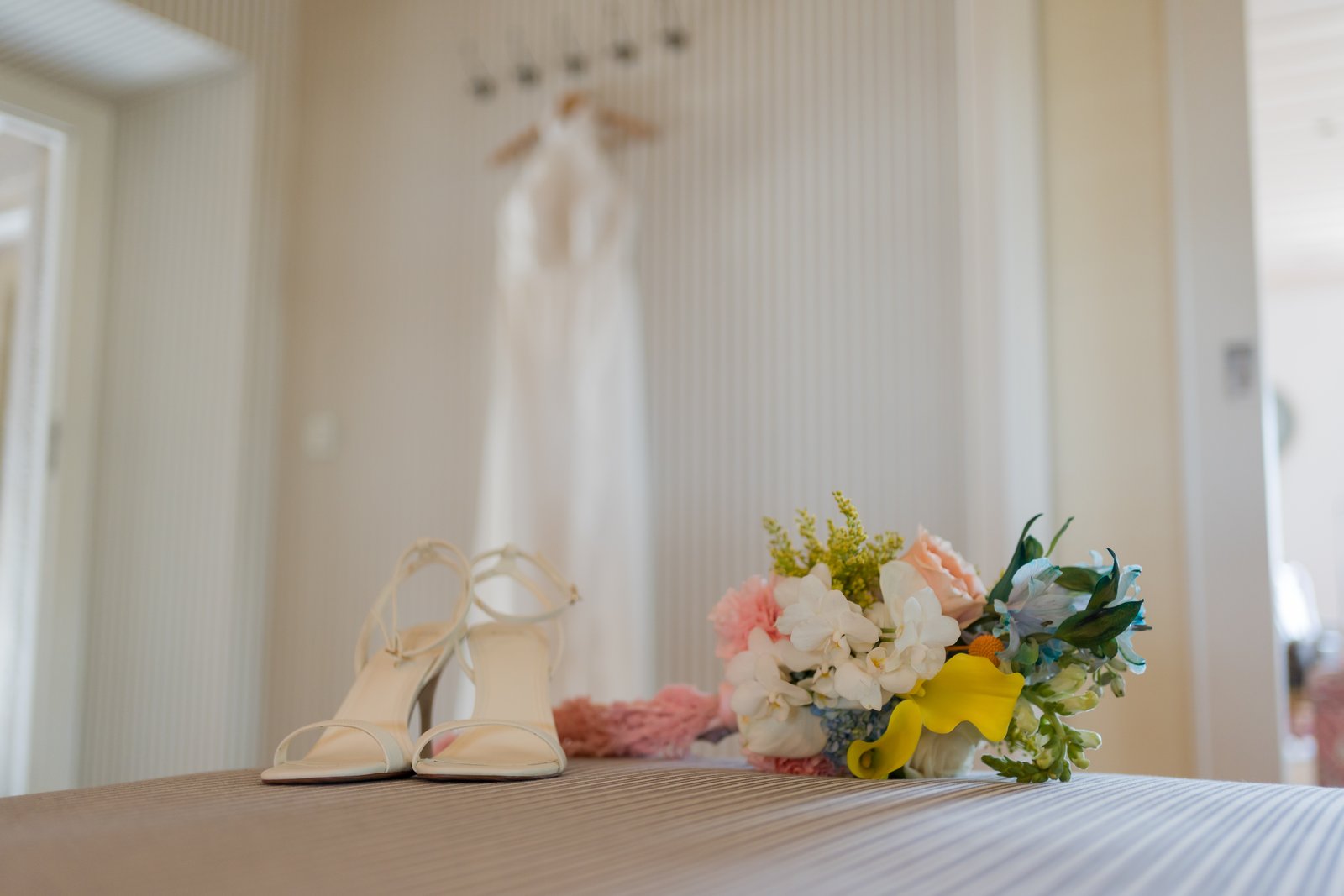 The wedding shoes and bouquet laid out before the ceremony at Quinta do Boiro