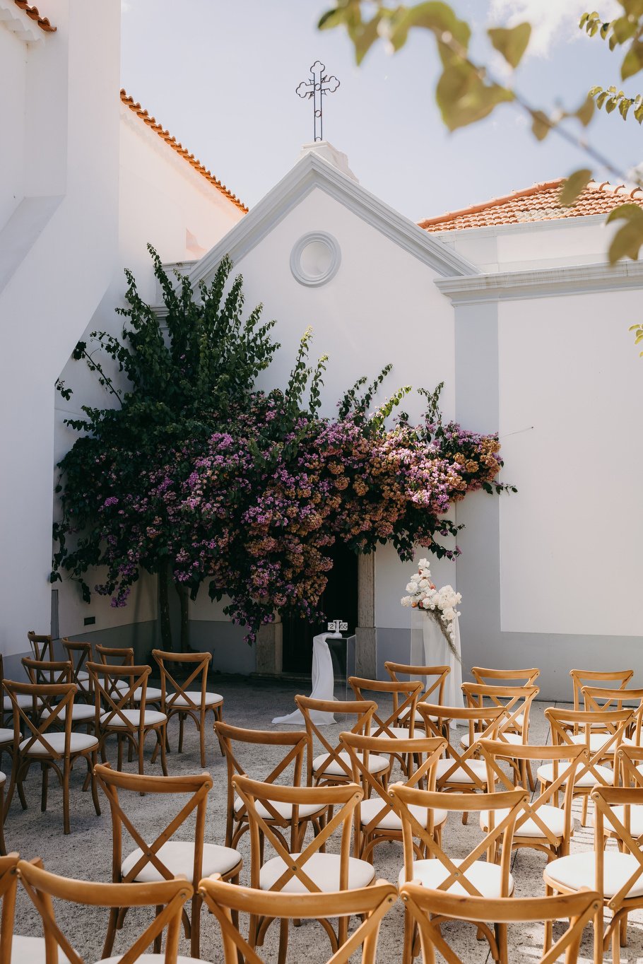 The baroque chapel at Quinta do Boiro, bougainvillea in flower and chairs set outside