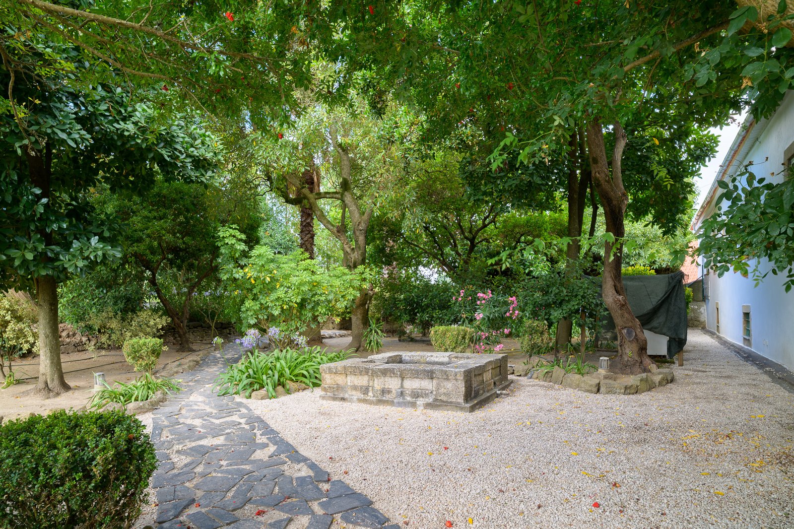 Stone fountain in the pebble garden
